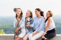 Beautiful funny girlfriends make selfies in the mountains on the background of nature. travel, summer, weekend, walk Royalty Free Stock Photo