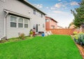 Beautiful furnished back yard with patio and fence.