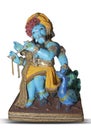 Beautiful Ganesha statue in the pose of Lord Krishna. Handcrafted, cute Ganesh murti on isolated background