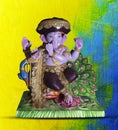 Beautiful Ganesha statue in the pose of Lord Krishna. Handcrafted, cute Ganesh murti on isolated background