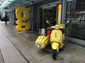 Yellow Scooter and Sidecar in front of Downtown Buildings in Vancouver, British Columbia