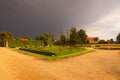 Beautiful garden in famous baroque palace Jaromerice nad Rokytnou against the dark thunderclouds