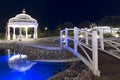 Beautiful garden with gazebo and wooden bridge with night lighting. North Cyprus landscape Royalty Free Stock Photo