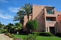 Beautiful garden at hotel resort and building in traditional arabic style. Resort architecture in Egypt Royalty Free Stock Photo