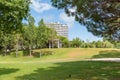 Garden of Troia covered with green trees near apartment complexes in Grandola municipality, Portugal