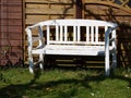 Beautiful garden wooden bench seating corner Royalty Free Stock Photo