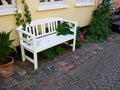 Beautiful garden wooden bench seating corner Royalty Free Stock Photo