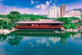 The beautiful garden with wooden house, fancy carp fish pond and building in Chi Lin Nunnery Temple and Nan Lian Garden At Kowloon Royalty Free Stock Photo