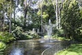 Beautiful gardens with fountains, conserved trees and palms in City of Wanneroo Western Australia Royalty Free Stock Photo