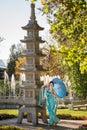 Beautiful geisha with a blue umbrella Royalty Free Stock Photo