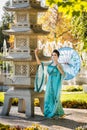 Beautiful geisha with a blue umbrella Royalty Free Stock Photo