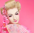 Beautiful geisha with fan