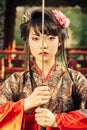 Beautiful geisha in kimono with samurai sword Royalty Free Stock Photo