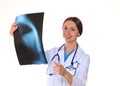 Beautiful general practitioner is working with joy. She is standing with a folder of documents in her hand Royalty Free Stock Photo