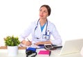 Beautiful general practitioner is working with joy. She is standing with a folder of documents in her hand Royalty Free Stock Photo