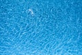 Beautiful gentle wave in swimming pool with sun reflection Royalty Free Stock Photo