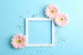Beautiful gerberas and frame on color background Royalty Free Stock Photo