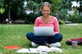 Beautiful german female student at computer learning and preparing for degree Royalty Free Stock Photo