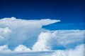 Beautiful Giant white cumulonimbus clouds against the background of the bright deep blue sky in tropical summer climate weather