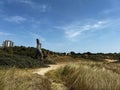 Beautiful giant wooden status Christophorus at the Belgian coast in the dunes on a sunny day Royalty Free Stock Photo