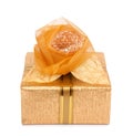 Beautiful gift box in gold paper with a silk rose Royalty Free Stock Photo