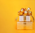 Beautiful Gift box in gold wrapping paper Royalty Free Stock Photo