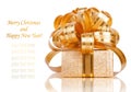 Beautiful Gift box in gold wrapping paper Royalty Free Stock Photo