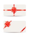 Beautiful gift cards with red bows and ribbons isolated on white background Royalty Free Stock Photo