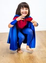 Beautiful giggling super hero child playing for exciting freedom Royalty Free Stock Photo