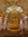 Gold Buddha statue at Yingtianmen Resort in Luoyang