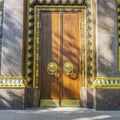 Gilding and monumental tree. entrance, gates, doors to a Buddhist temple. the concept of reliable protection