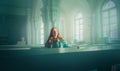 A beautiful ginger young woman is sitting on benches in a Protestant church, consecrated by the soft light from the windows. The