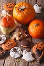 Beautiful gingerbread for Halloween and pumpkin close-up. Vertic Royalty Free Stock Photo