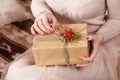 Beautiful gir with cristmas gift box. lWoman`s hands holding gold gift box. Christmas, new year, birthday concept. Festive