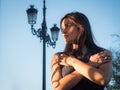 Beautiful girl alone against blue sky Royalty Free Stock Photo