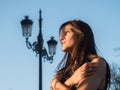 Beautiful girl alone against blue sky Royalty Free Stock Photo