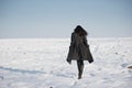 Beautiful girl alone in winter field