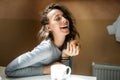 Beautiful girl with an apple in her hand laughing at the camera