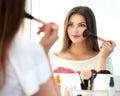 Beautiful girl applying makeup Royalty Free Stock Photo