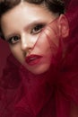 Beautiful girl with art creative make-up in image of red bride for Halloween. Beauty face. Royalty Free Stock Photo