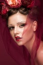 Beautiful girl with art creative make-up in image of red bride for Halloween. Beauty face. Royalty Free Stock Photo