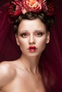 Beautiful girl with art creative make-up in image of red bride for Halloween. Beauty face.