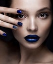 Beautiful girl with art make-up, dark glitter lips design and manicured nails. beauty face. Royalty Free Stock Photo