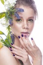 Beautiful girl with art make-up, flowers, and design nails manicure. beauty face. Royalty Free Stock Photo