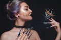 Beautiful girl with art make up in pirate style, creative long nails. Design manicure. Beauty face. Royalty Free Stock Photo