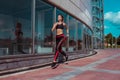 Beautiful girl athlete running morning jog summer city. Sportswear Leggings Top. Fitness, youth lifestyle, healthy in