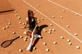 Beautiful girl athlete on the tennis court. Tennis training, racket and ball, concept. Royalty Free Stock Photo