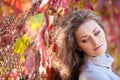 Beautiful girl in autumn park