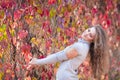 Beautiful girl in autumn park