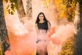 Woman with a colorful smoke bomb, ideas for party Royalty Free Stock Photo